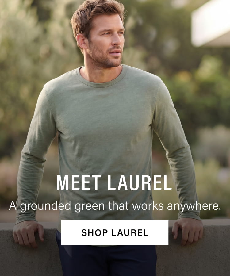 Man wearing a long-sleeve Tri- Blend Scallop Crew laurel green shirt. Text overlay reads: MEET LAUREL, A grounded green that works anywhere. SHOP LAUREL.