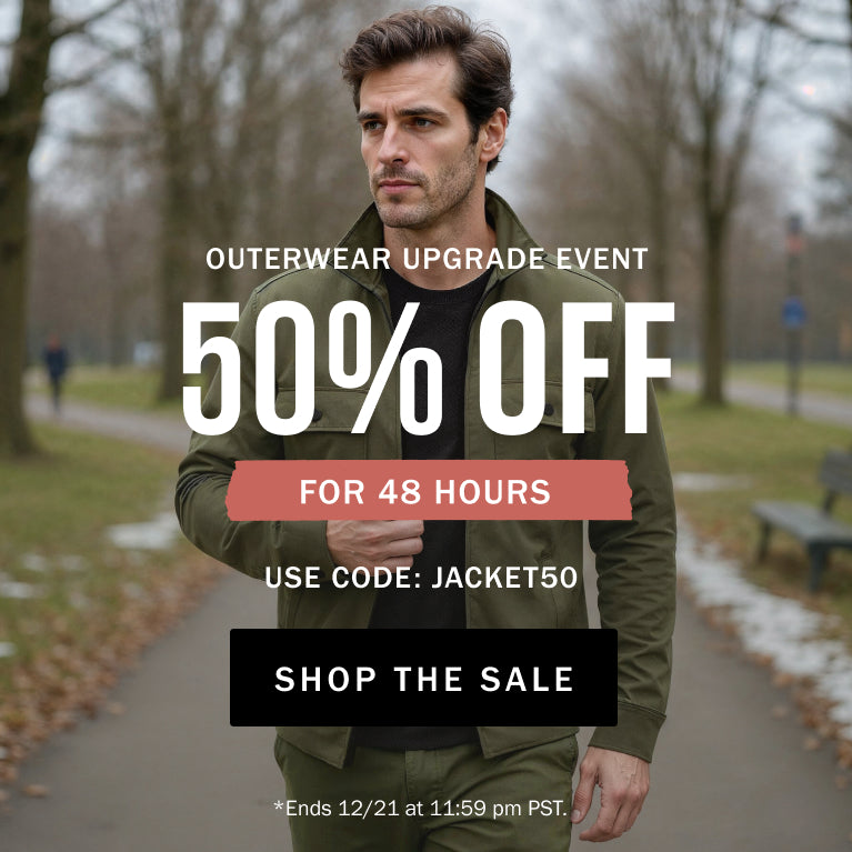 Man wearing a green jacket in a park with promotional text overlay for an outerwear sale.
